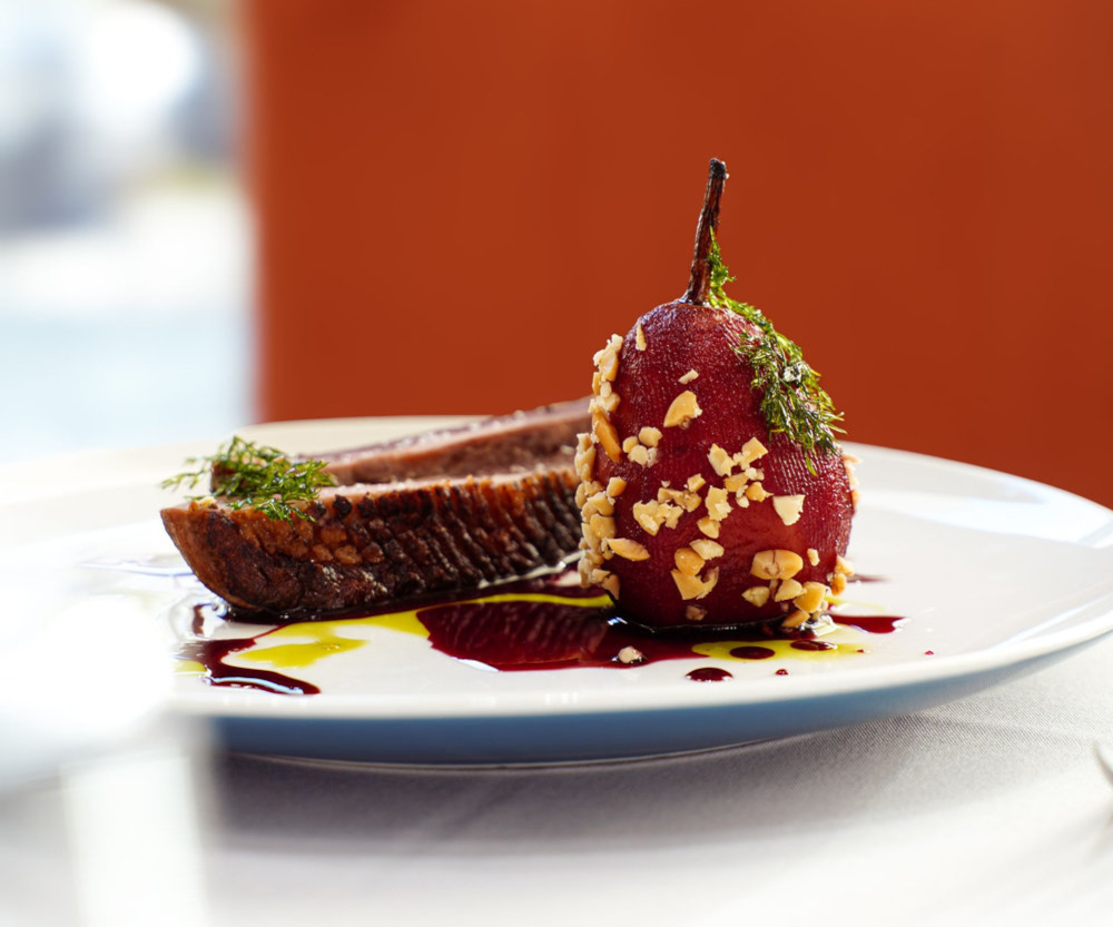 Duck breast with poached pears and red wine sauce