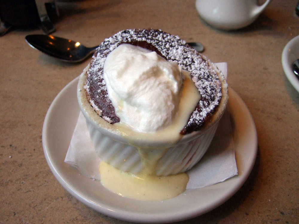 Chocolate soufflé with vanilla custard